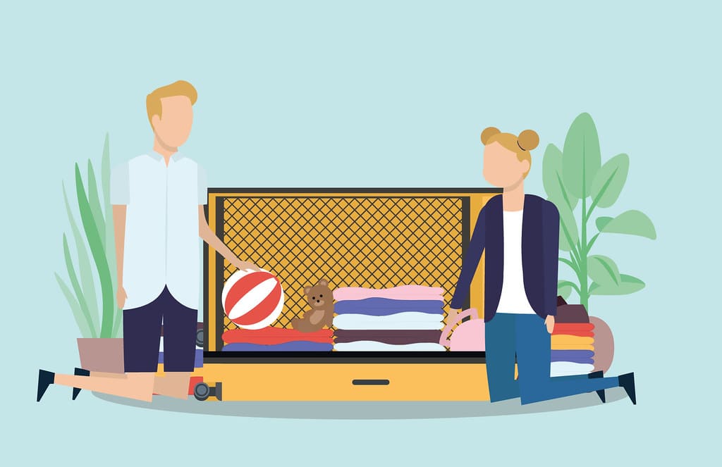 An open suitcase neatly packed with folded clothes ready for a family vacation